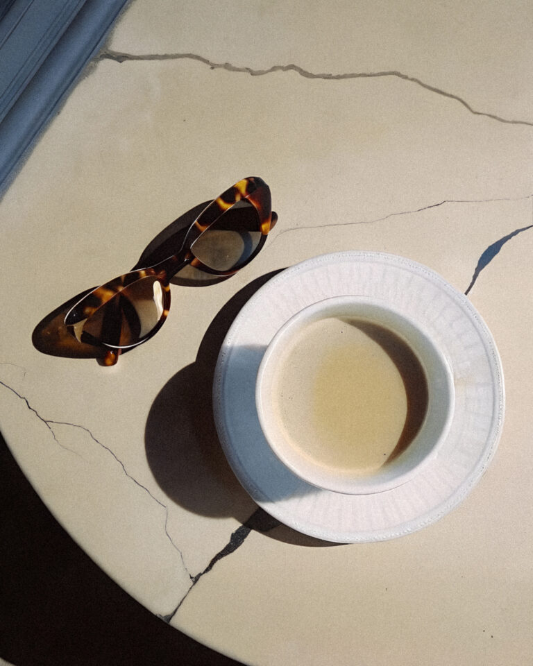 Biohacking Starter Kit: Daily Biohacking Routine 31 a cup of coffee and sunglasses on a table